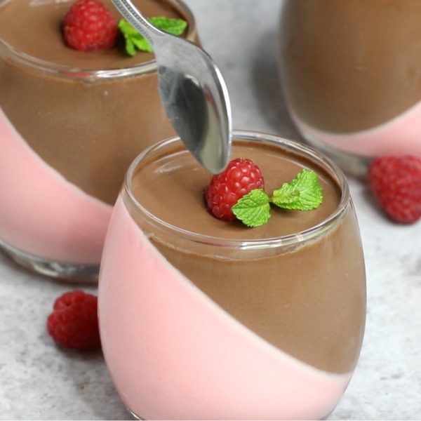 Raspberry Chocolate Mousse - this photo shows a close-up of this dessert being spooned out of a stemless wine glass