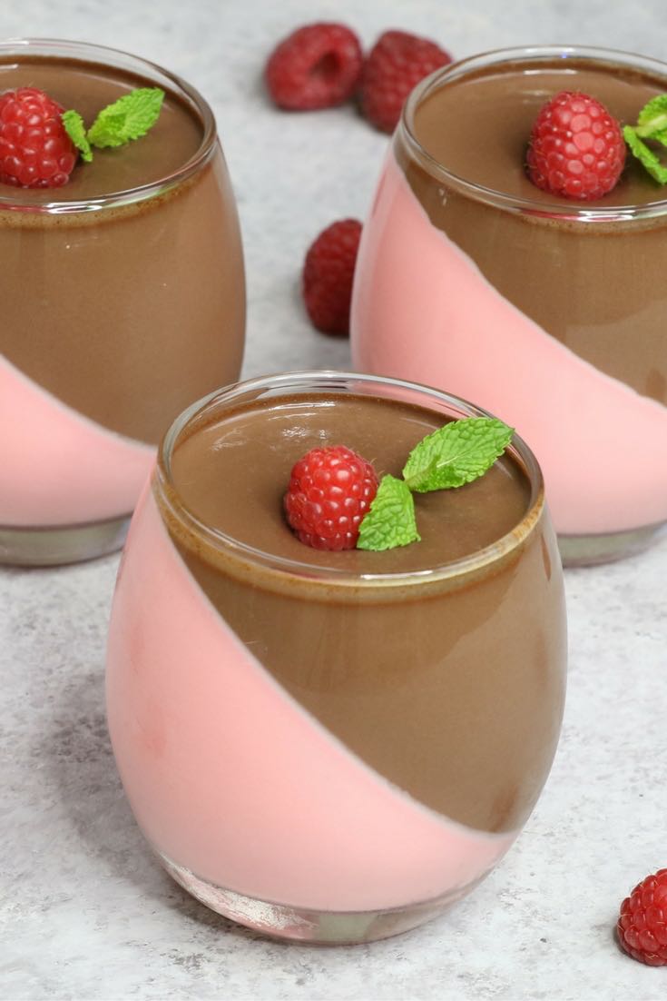 Raspberry And Chocolate Mousse – looks so elegant with two layers and tastes so delicious that you won’t believe how easy it is to make! Creamy, rich and smooth dessert topped with fresh raspberry and mint. All you need is some simple ingredients: raspberry jello, whipped cream, gelatin, heavy cream, sugar and chocolate. Wow your guest with this refreshing dessert at your next party! No bake dessert. Video recipe. tipbuzz.com