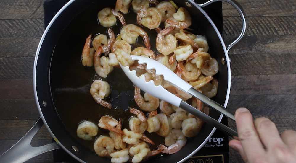 Remove cooked shrimp from the pan