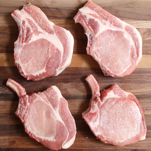 This photos show uncooked rib chops cut two different ways: without the bone exposed and Frenched or with bone exposed. They make delicious grilled or baked pork chops