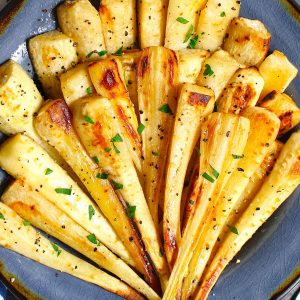 Roasted Parsnips are a very simple but delicious vegetable side dish that’s sweet and tender. This recipe makes perfect parsnips with a caramelized surface that enhances the natural flavor.