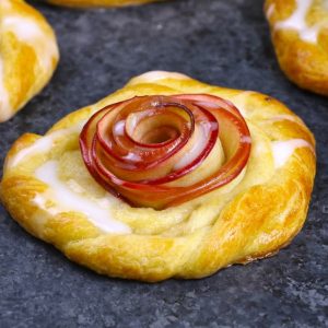 This Rose Apple Danish has a beautiful apple rose in the middle surrounded by flaky pasty and topped with homemade icing