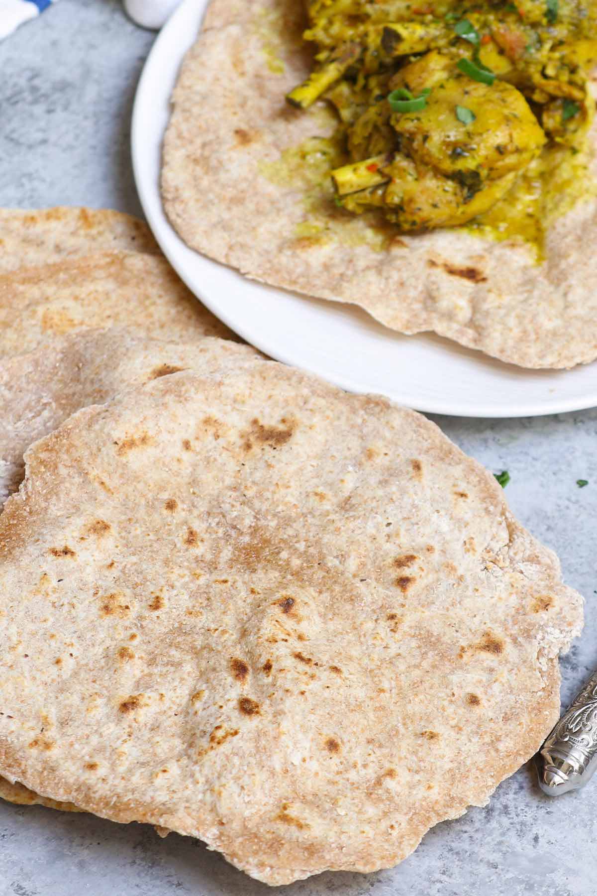 Roti flatbreads with chicken curry