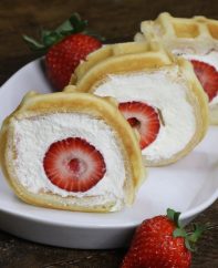 Strawberry Waffle Roll Cake - a quick and easy breakfast, snack or dessert made with waffles, fresh strawberries, and whipped cream. Soft waffle topped with whipped cream, and strawberries. It melts in your mouth! So good and so beautiful! No bake dessert, vegetarian! | tipbuzz.com