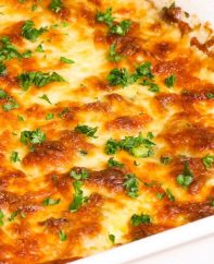 Scalloped Potatoes and Ham loaded with tender potatoes, layered with ham and cheese and smothered in a rich and creamy sauce. The best way to achieve soft and creamy potatoes is by par-boiling the potatoes first before baking. This is the best scalloped potatoes recipe ever!