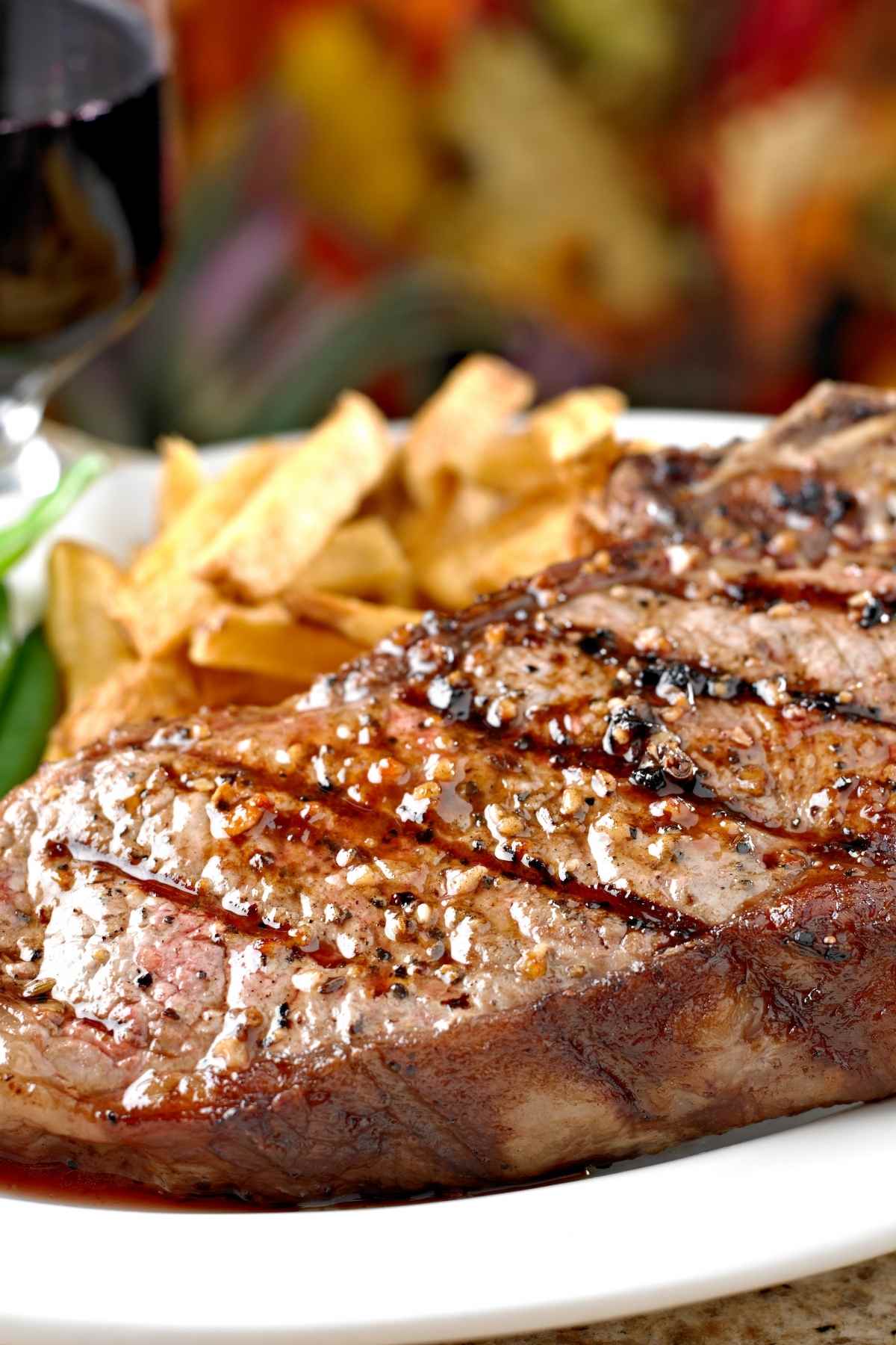 Grilled steak with cracked black pepper