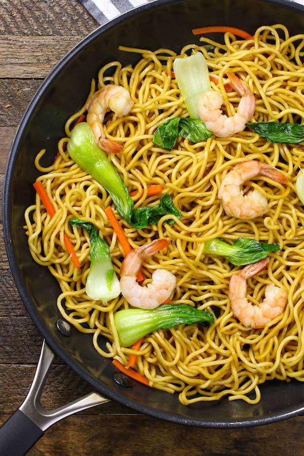 A large skillet with freshly made shrimp chow mein
