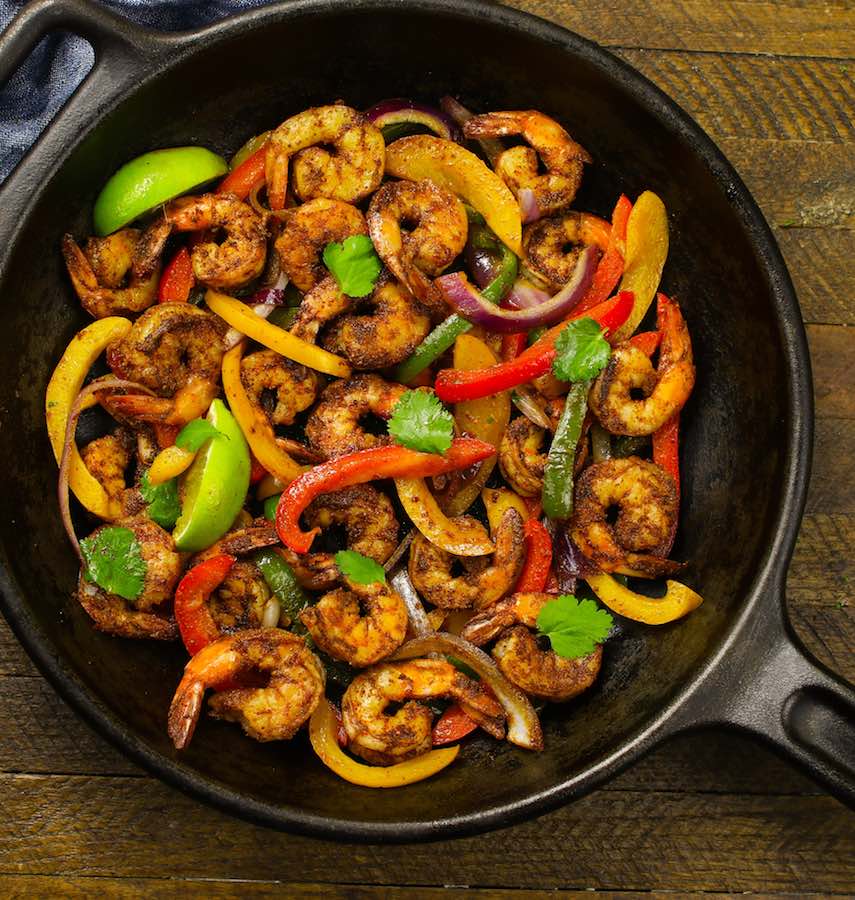 Shrimp Fajitas in a cast iron skillet