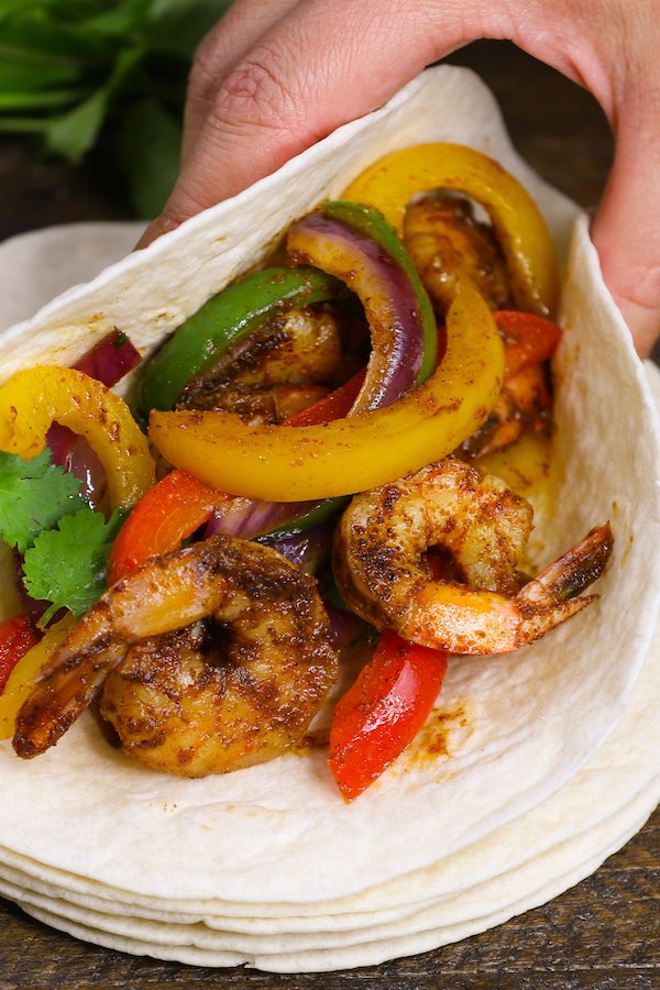 These Shrimp Fajitas are easy to make in just 15 minutes – sizzling, caramelized shrimp cooked with seared bell peppers and onions in flavorful fajita seasonings. It’s like restaurant-style fajitas but even better!