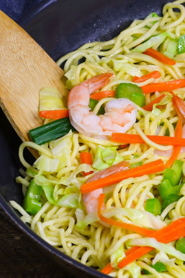 Shrimp Lo Mein with a wooden spoon