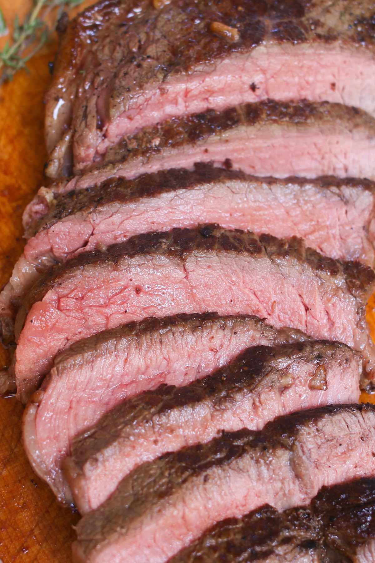 Slices of juicy sirloin steak cooked to medium doneness