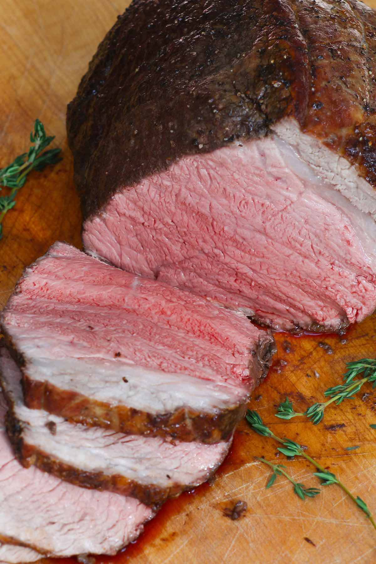 Sirloin tip roast cooked medium rare with a warm pin-red centre