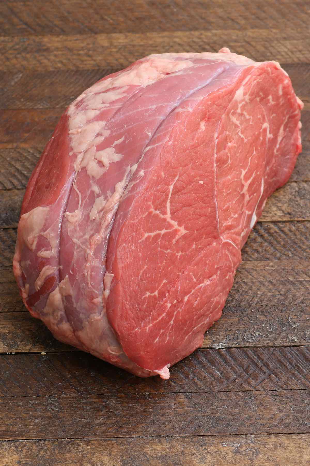 A raw round tip roast