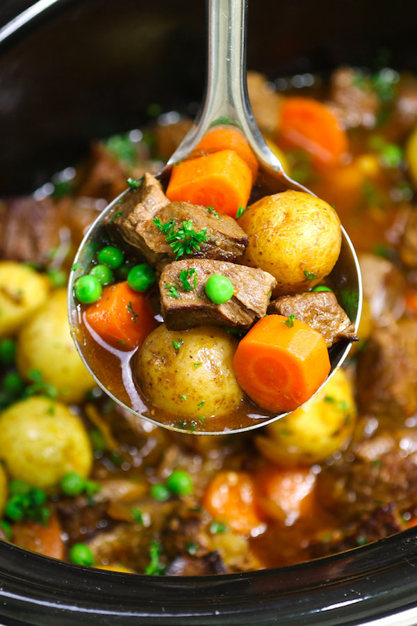 Closeup of a ladle full of beef stew made in the crock pot