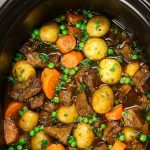Slow Cooker Beef Stew is one of the best hearty and comfort food to make in a crock pot. Tender and melt-in-your-mouth beef is simmered in a rich and divine sauce with carrots, onions, and potatoes. Your family and friends will ask for this Crock Pot Beef Stew again and again! Plus recipe video tutorial!
