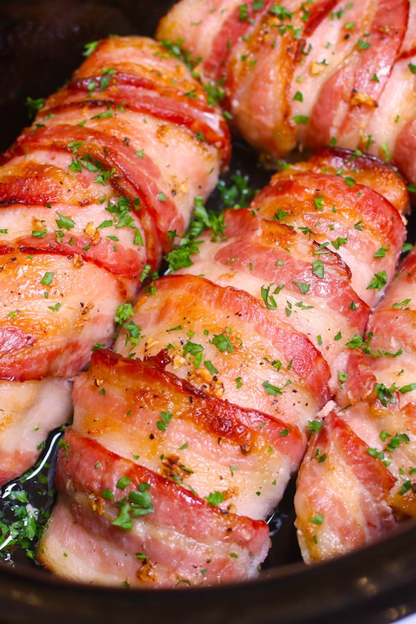 Slow Cooker Bacon Garlic Chicken Breast is a tender and juicy chicken dinner with just 4 simple ingredients and 15 minutes of prep! Boneless, skinless chicken breasts get seasoned and wrapped with bacon so the chicken stays moist and absorbs delicious flavors in the crock pot.