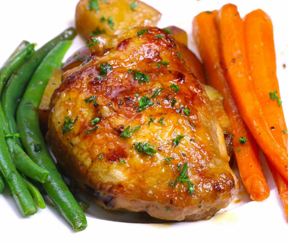 This photo shows Honey Garlic Chicken from a slow cooker served on a plate ready to be eaten