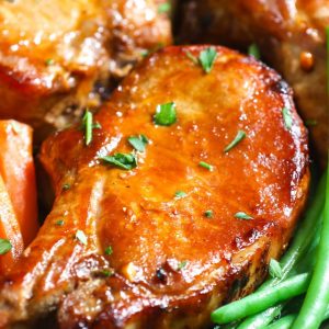 Closeup of Slow Cooker Pork Chops made with bone in rib chops and a delicious gravy