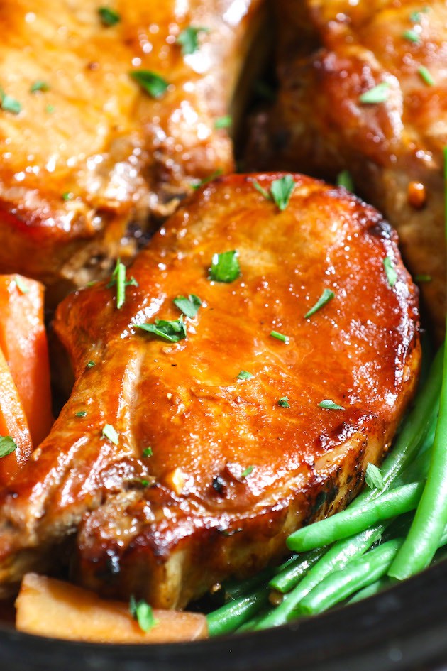 Closeup of Slow Cooker Pork Chops made with bone in rib chops and a delicious gravy