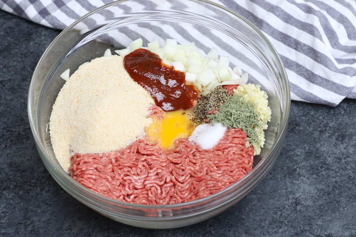 Ingredients for meatloaf in a mixing bowl