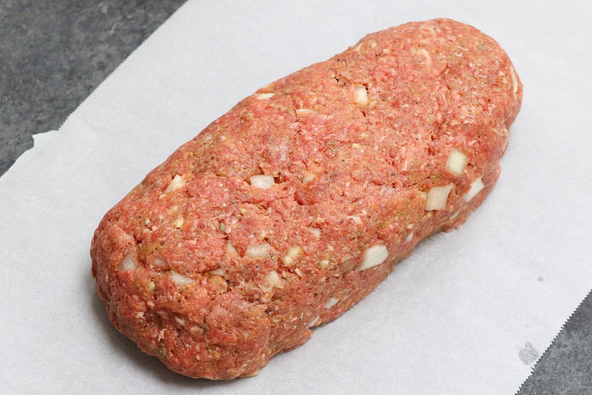 Freeform meatloaf with an ovan shape ready for cooking