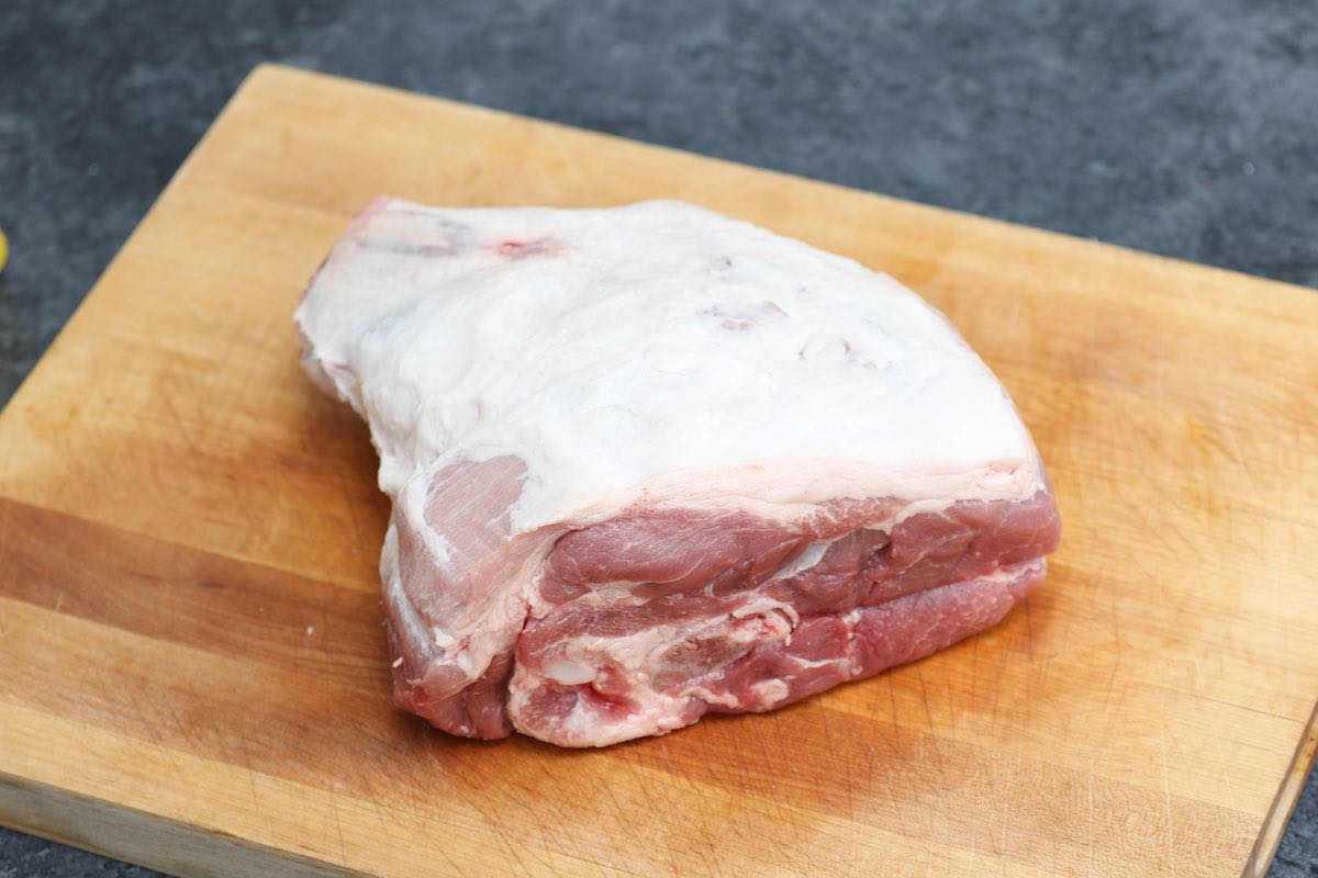 A bone-in pork picnic shoulder with skin and excess fat removed