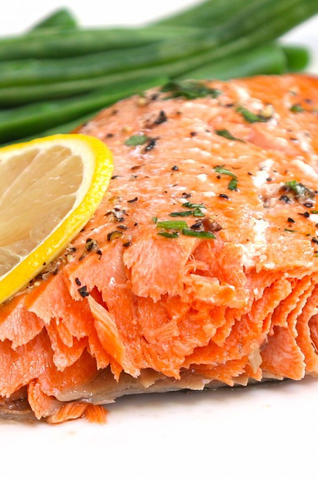 Closeup of sockeye salmon baked to medium rare doneness showing a moist and flakey texture