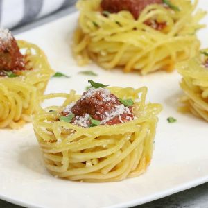 Baked spaghetti and meatball cups are a fabulous party appetizer that's bursting with delicious flavors