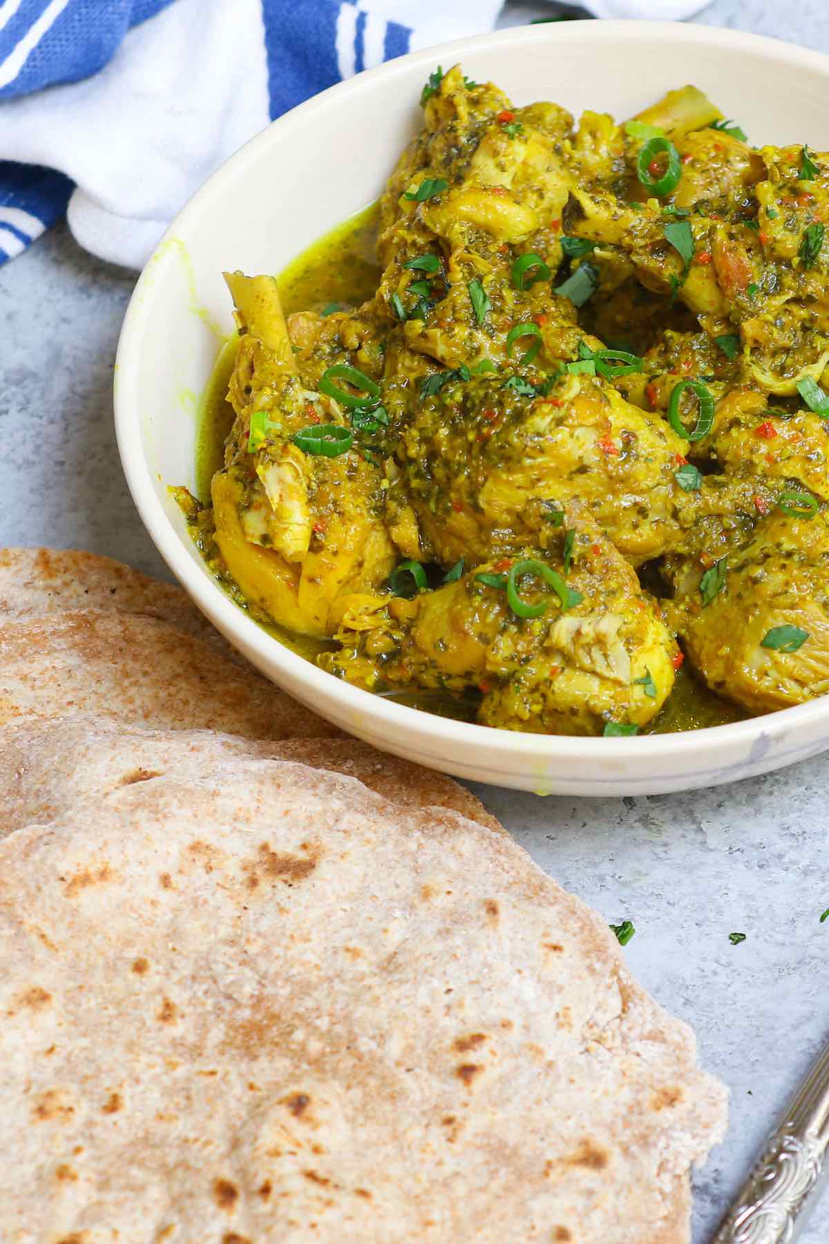 A serving of Trinidad Curry Chicken with roti