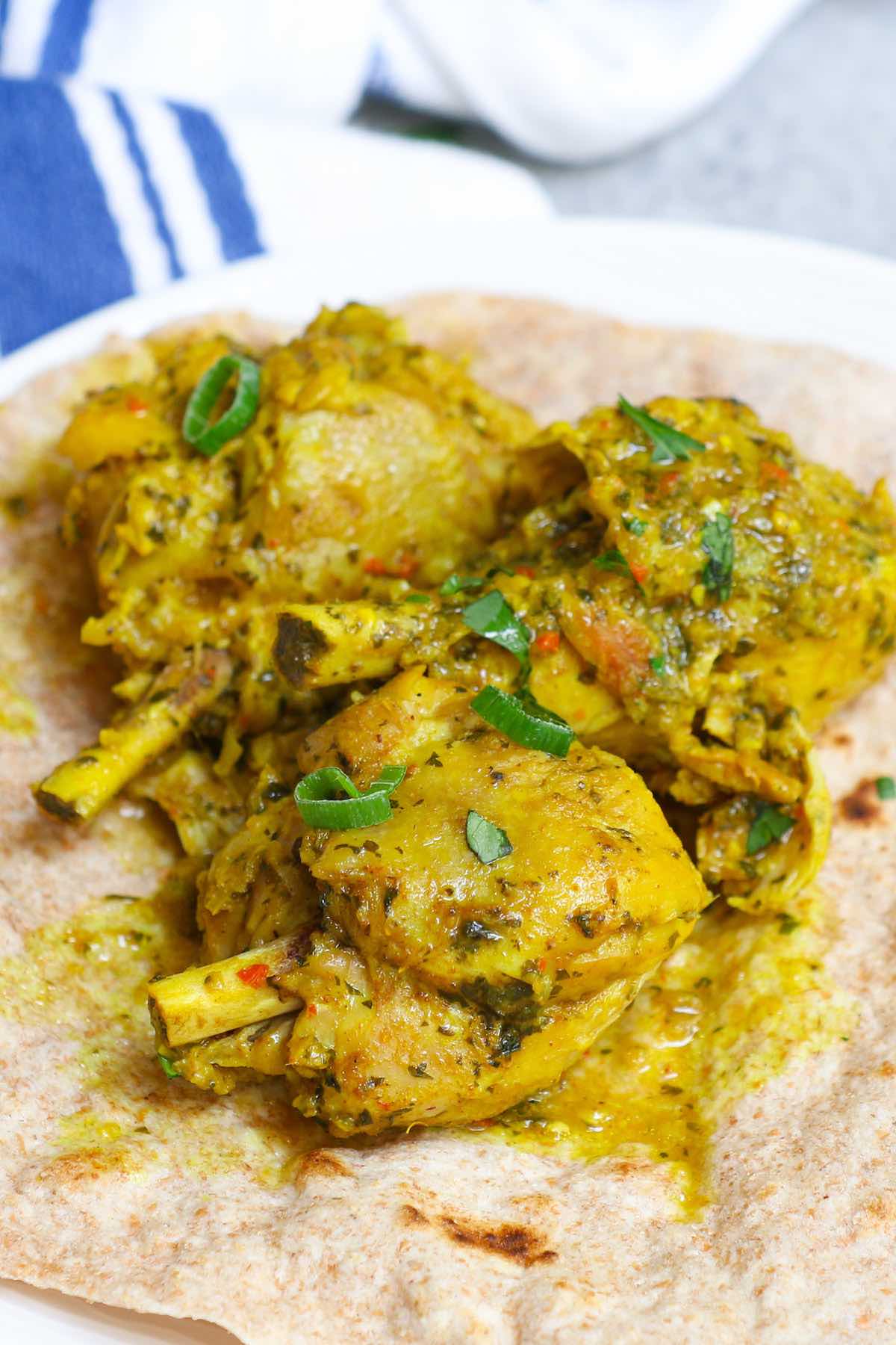 Curry chicken pieces on roti