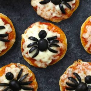 These Mini Spider Pizzas are the perfect snack for some spooky fun at your Halloween party