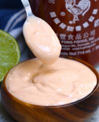 This Spicy Sriracha Aioli is a tasty condiment you can serve as a dipping sauce with fish tacos, crab cakes or French fries. It also makes a delicious spread on black bean burgers and baked potatoes. #Sriracha Aioli #Spicy Aioli