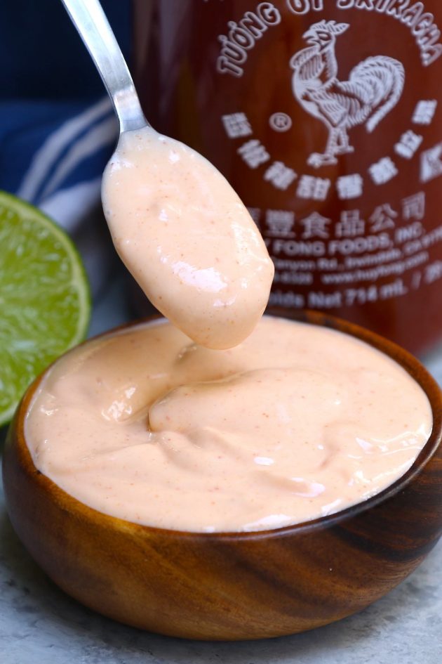 This Spicy Sriracha Aioli is a tasty condiment you can serve as a dipping sauce with fish tacos, crab cakes or French fries. It also makes a delicious spread on black bean burgers and baked potatoes. #Sriracha Aioli #Spicy Aioli