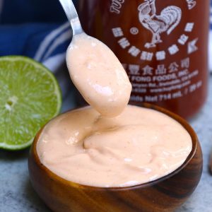 This Spicy Sriracha Aioli is a tasty condiment you can serve as a dipping sauce with fish tacos, crab cakes or French fries. It also makes a delicious spread on black bean burgers and baked potatoes.