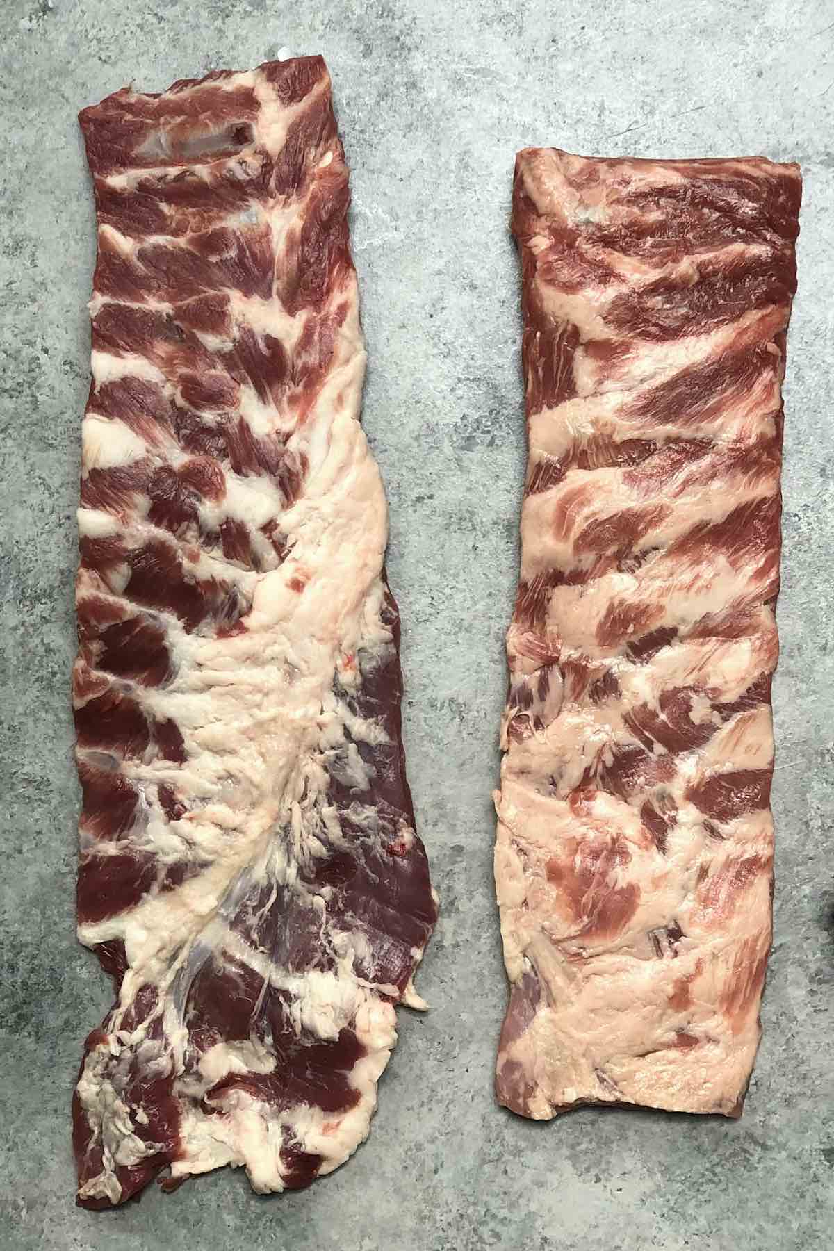 Side-by-side comparison of a rack of spare ribs and St Louis ribs