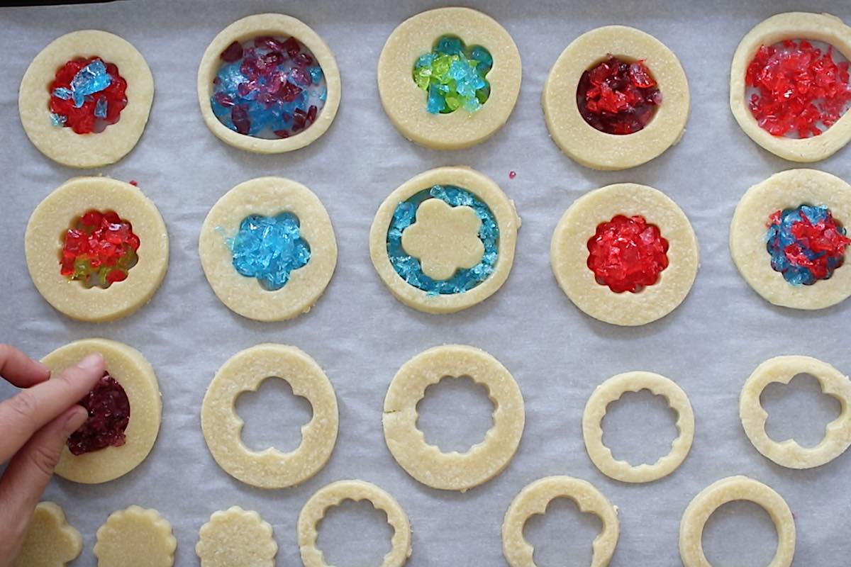 Closeup of filling cookie centers with crushed candies.