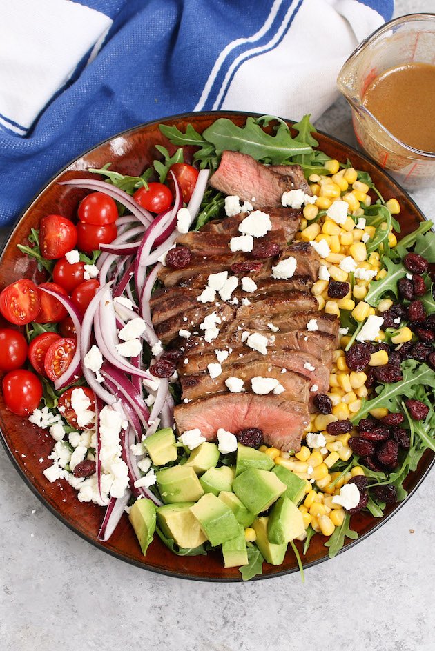 Steak Salad is a hearty and incredibly delicious meal for lunch or dinner. A flavorful steak salad recipe combines perfectly pan-seared juicy steak with fresh vegetables and balsamic vinaigrette dressing.