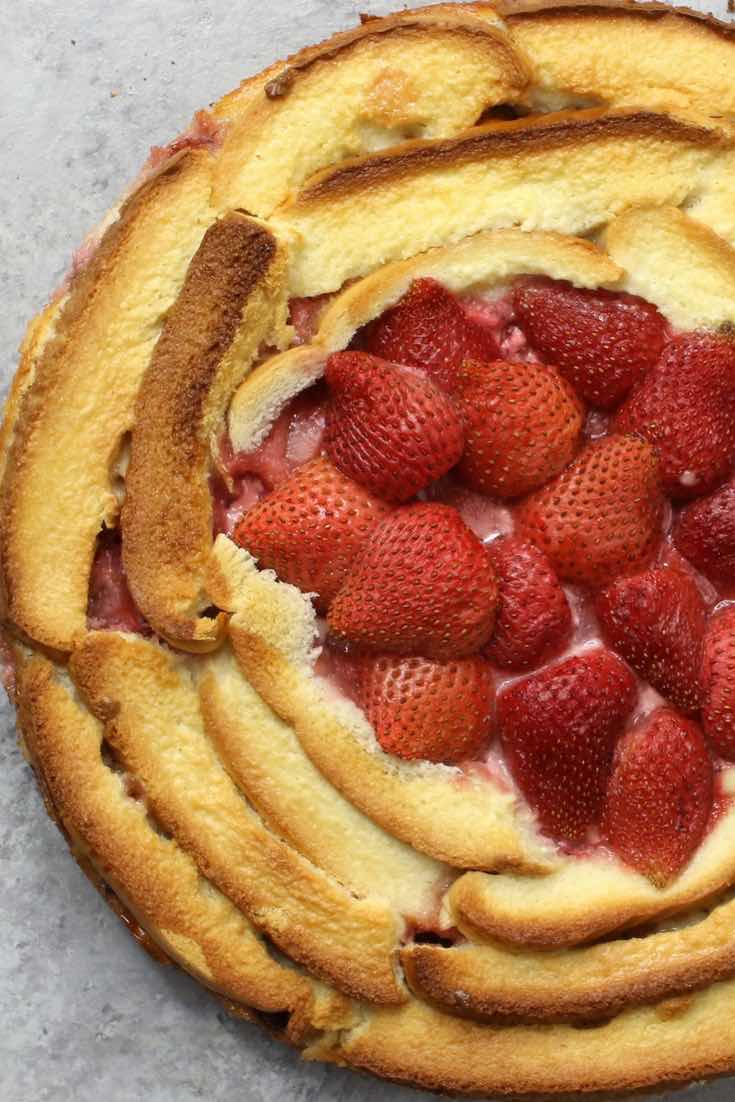 Freshly baked Strawberry Bread Pudding made with leftover bread crusts, fresh strawberries and a creamy cheesecake filling. An ideal dessert for a party or holiday like Easter and Mother's Day. 