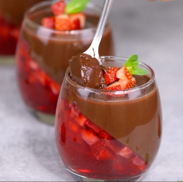 Strawberry Chocolate Mousse serving spoon lifting out some of the chocolate pudding layer