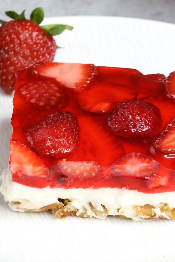 Strawberry pretzel salad is a 3-layer dessert consisting of a strawberry jello topping, a cheesecake filling and a caramelized pretzel crust. It's often called strawberry pretzel dessert or simply jello pretzel dessert.