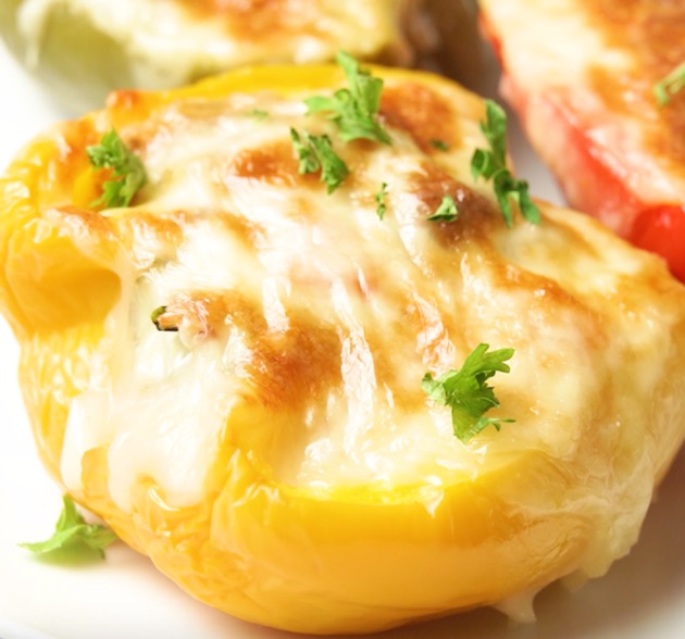 Closeup of baked bell peppers stuffed with beef and rice