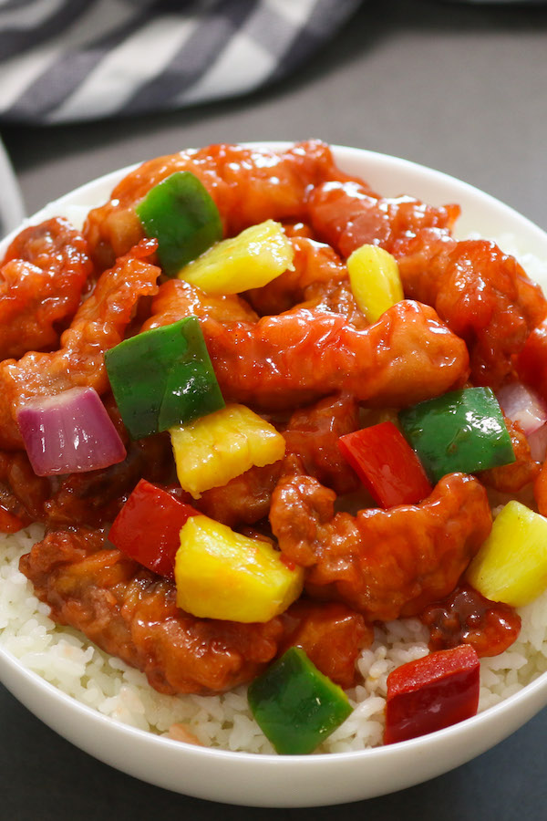 Homemade Sweet and Sour Pork served in a rice bowl