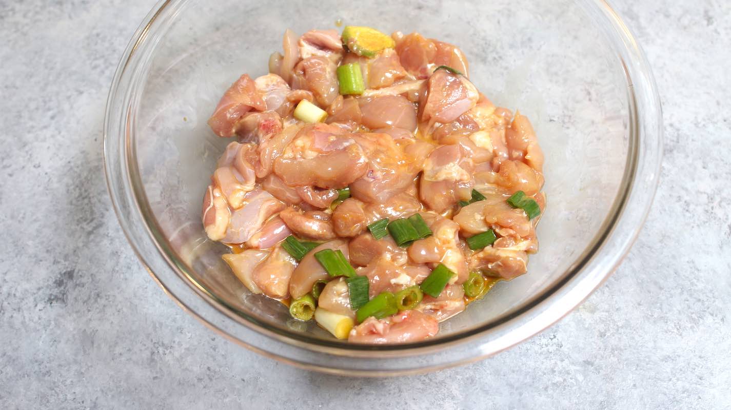 Marinate cubed chicken thighs in the bowl.