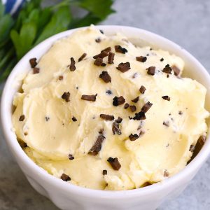 Truffle Butter is a delicious homemade spread made with just 3 ingredients: butter, truffles and salt! Variations include black truffle butter with a nuttier flavor and white truffle butter for a muskier flavor. This condiment is a fabulous addition to steak, seafood, poultry, vegetables, pasta and more!