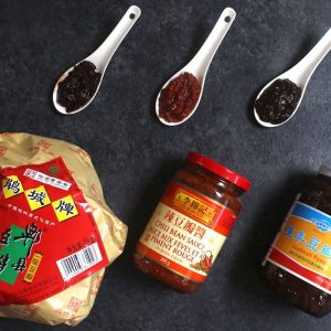 Doubanjiang is a Chinese bean paste with savory and sometimes spicy accents that makes many popular Chinese stir-fry recipes. Learn about the different types of Doubanjiang, how to use it, recommended brands, substitutes and more!