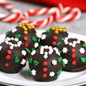 Ugly Christmas Sweater Oreo Truffles are an adorable holiday treat or gift idea made with oreo cookies, cream cheese and semisweet chocolate for delicious bites of awesomeness
