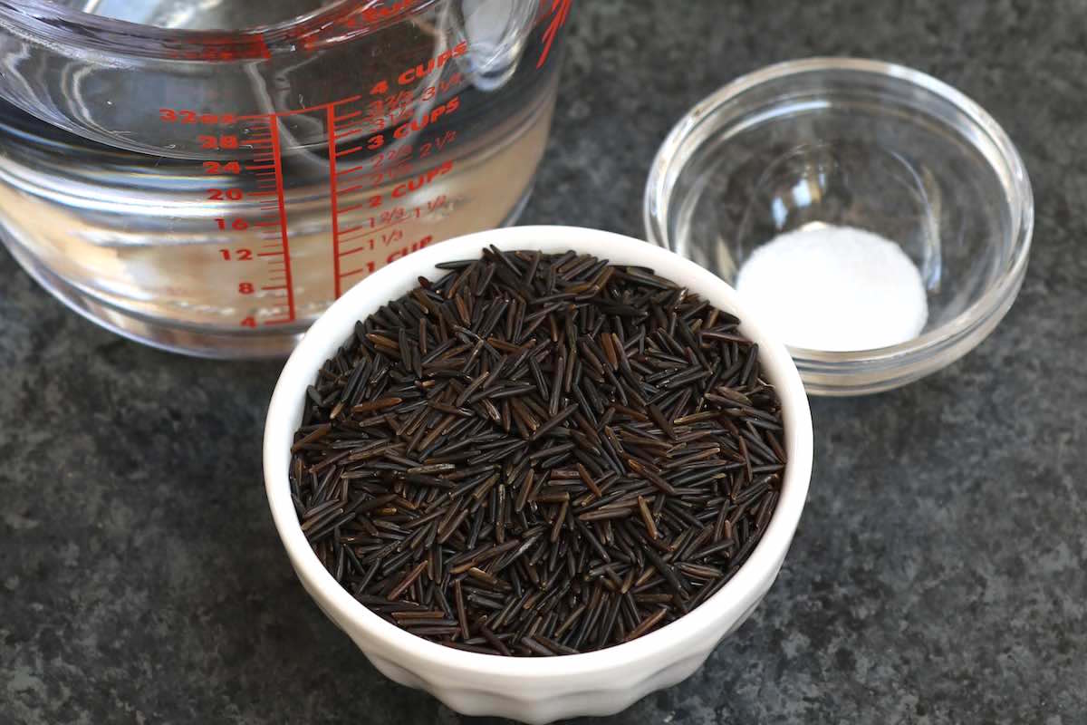 Uncooked wild rice with water and optional salt before cooking