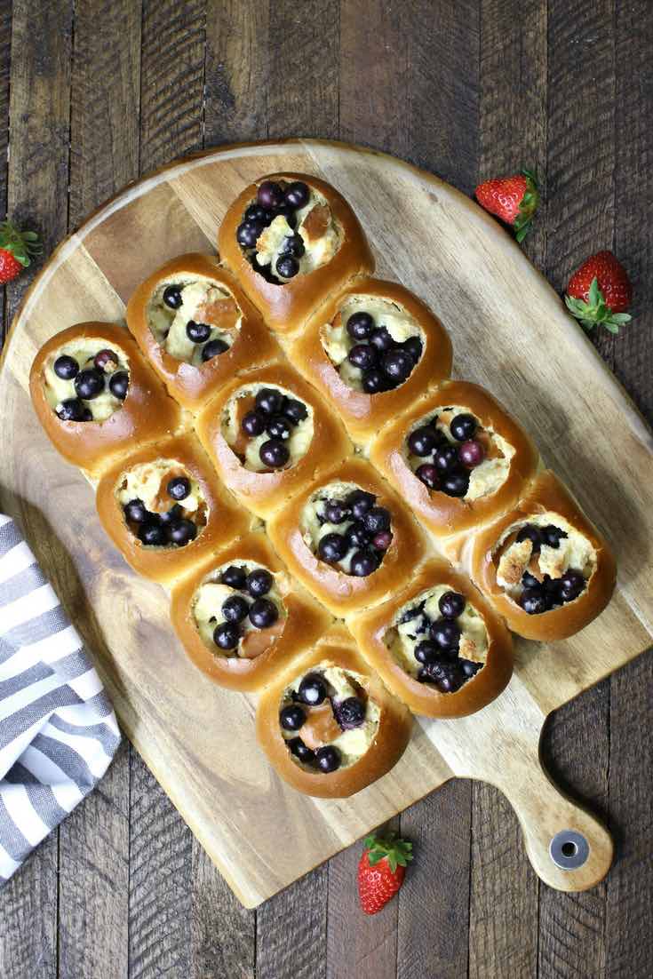 Pull apart blueberry bread pudding sliders on a serving platter