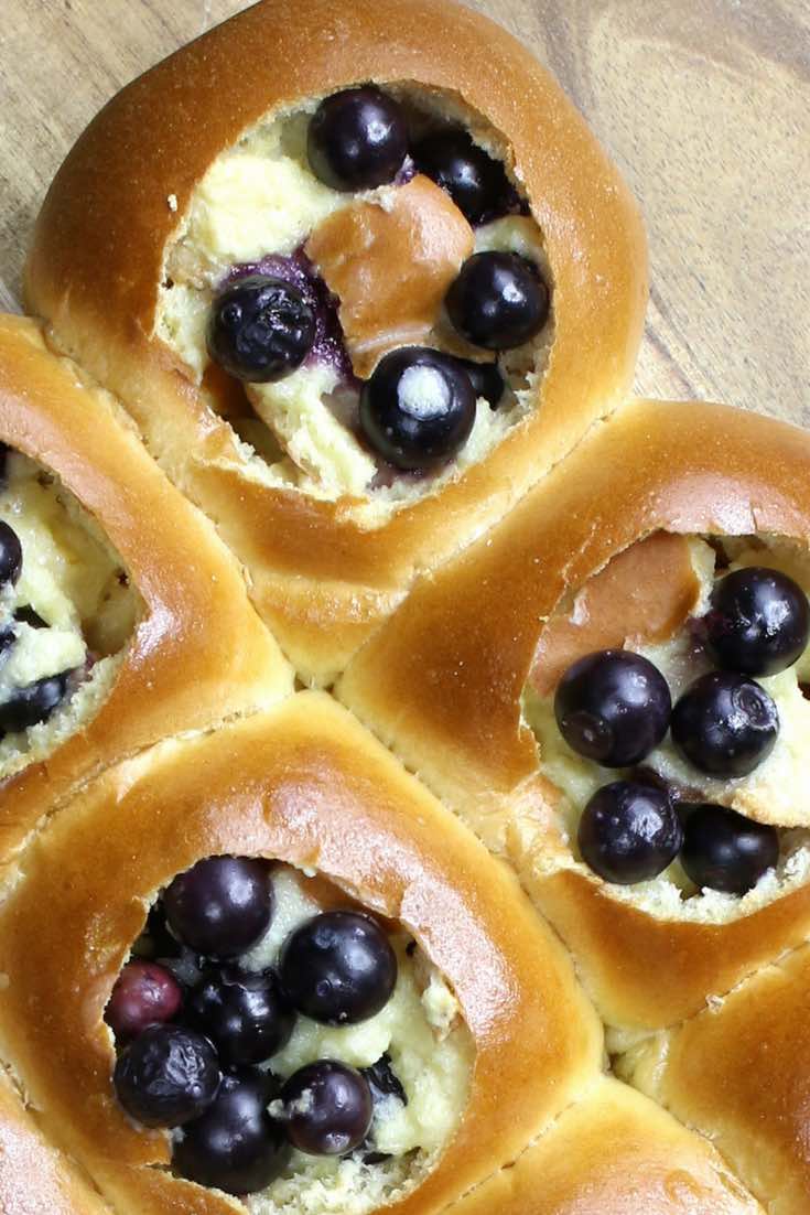 Closeup of blueberries in Hawaiian dinner rolls