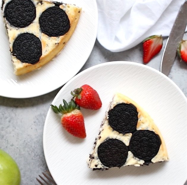 Servings of Upside Down Oreo Cheesecake with garnish for fresh strawberries for a beautiful homemade dessert